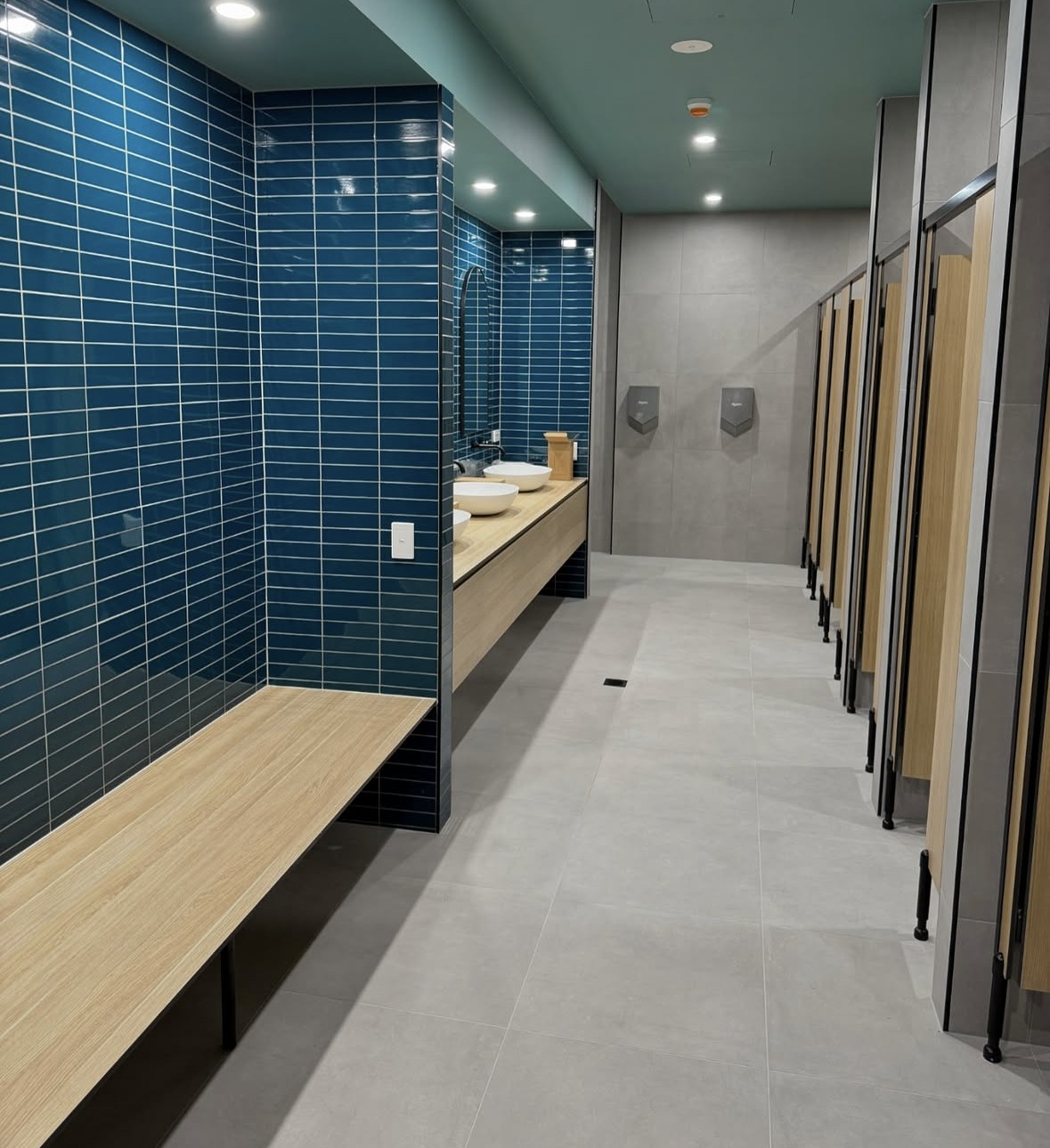 Blue tile detailing in completed commercial amenities
