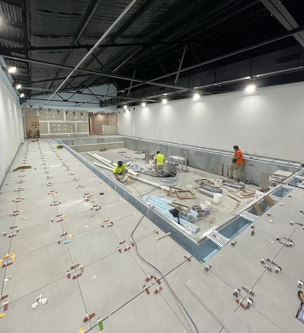 Commercial floor tile set-out and installation in progress