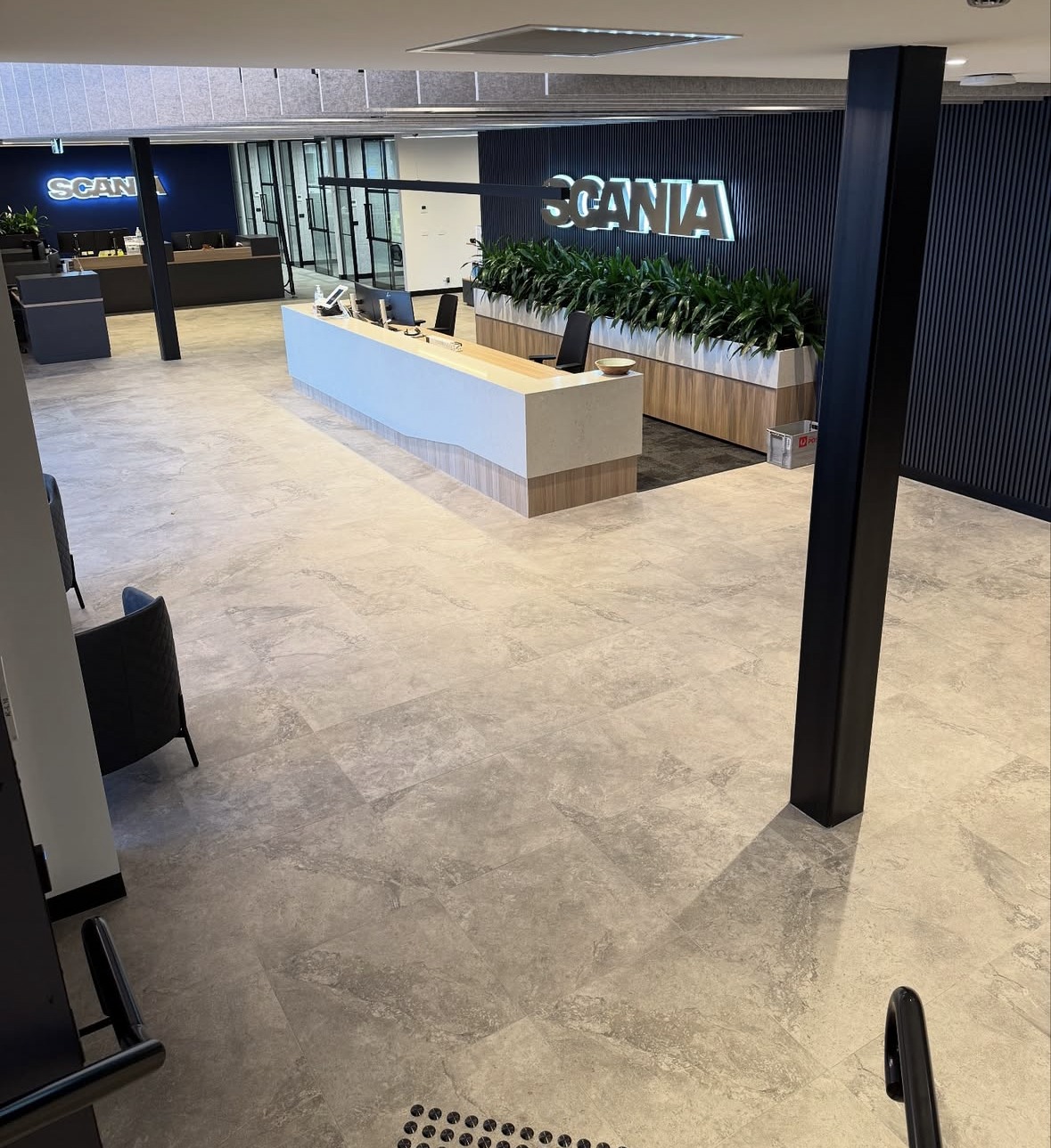 Scania Commercial Fit-Out: Large-format commercial flooring and reception finishes for a corporate fit-out.