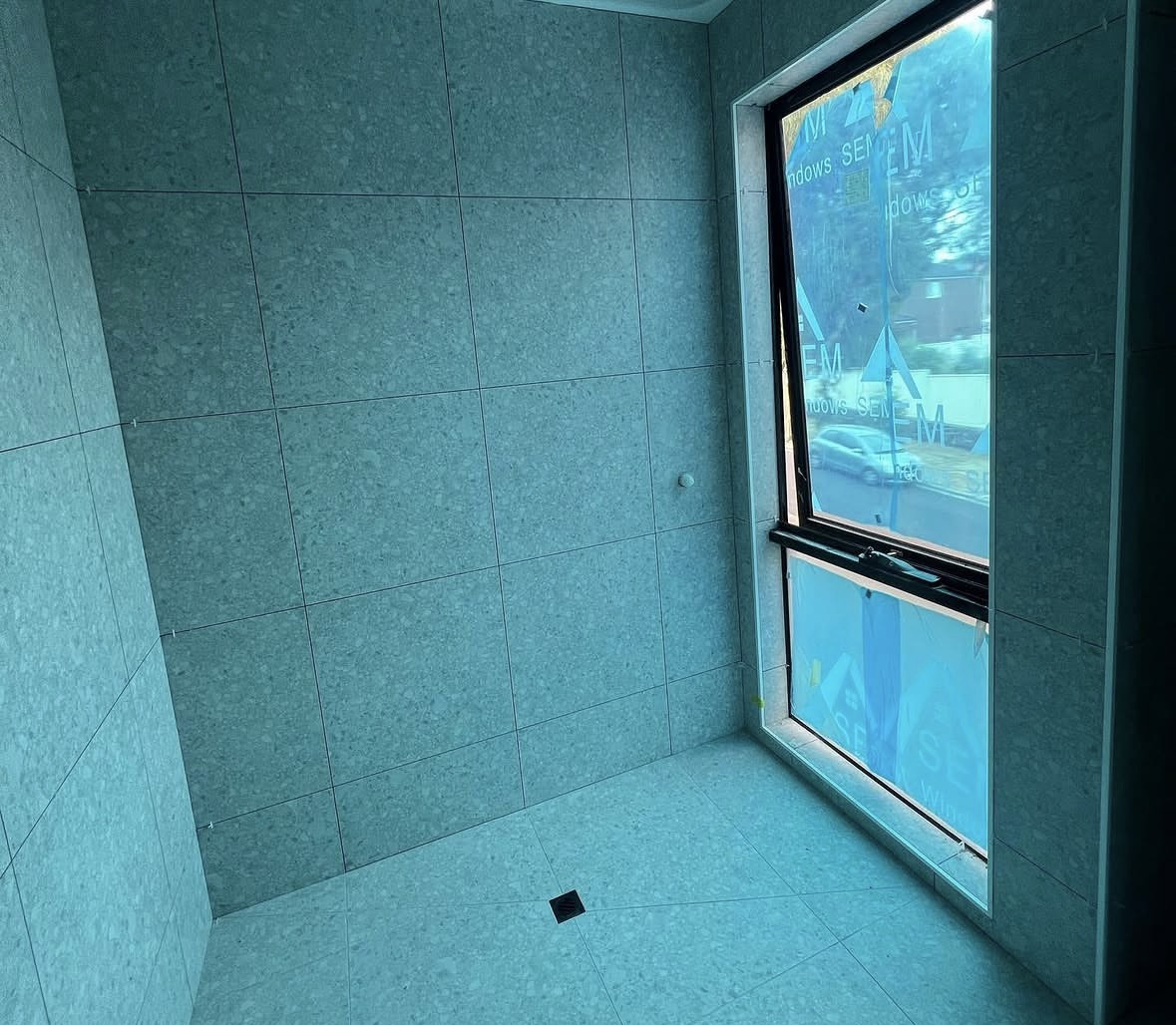 Waterproofing membrane through an internal wet area